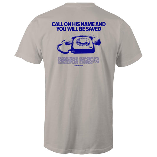 Christian t-shirt featuring a bold blue graphic of a vintage rotary phone with the text “Call on His name and you will be saved” above it. Below, Romans 10:9–13 is printed in full, sharing the gospel message clearly. A bold evangelistic design by Lighthouse Christian Clothing, sparking faith-based conversations.