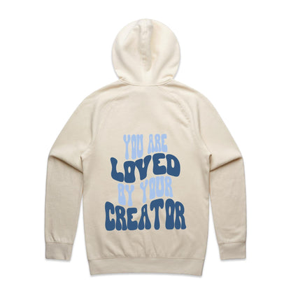 Christian hoodie with bold, wavy text on the back reading “You are LOVED by your CREATOR” in layered light and dark blue lettering. A comforting, gospel-centered design by Lighthouse Christian Clothing, reminding wearers of their unshakable identity and worth in the eyes of their Creator.