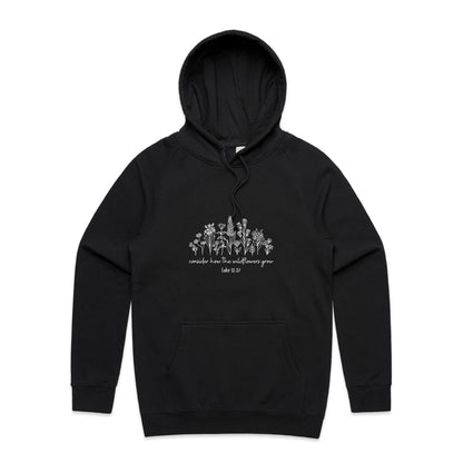 Christian hoodie with white wildflower illustration and Bible verse 'Consider how the wildflowers grow – Luke 12:27' — cozy faith-based apparel by Lighthouse Christian Clothing.