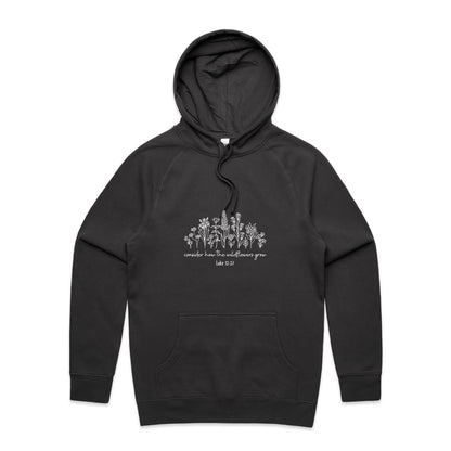 Christian hoodie with white wildflower illustration and Bible verse 'Consider how the wildflowers grow – Luke 12:27' — cozy faith-based apparel by Lighthouse Christian Clothing.